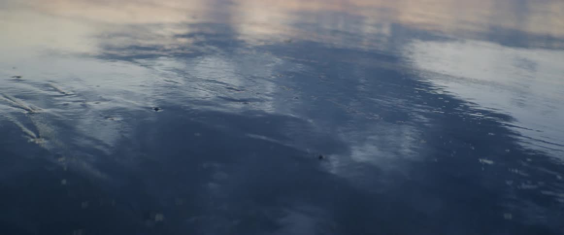 Water flows over a sandy surface