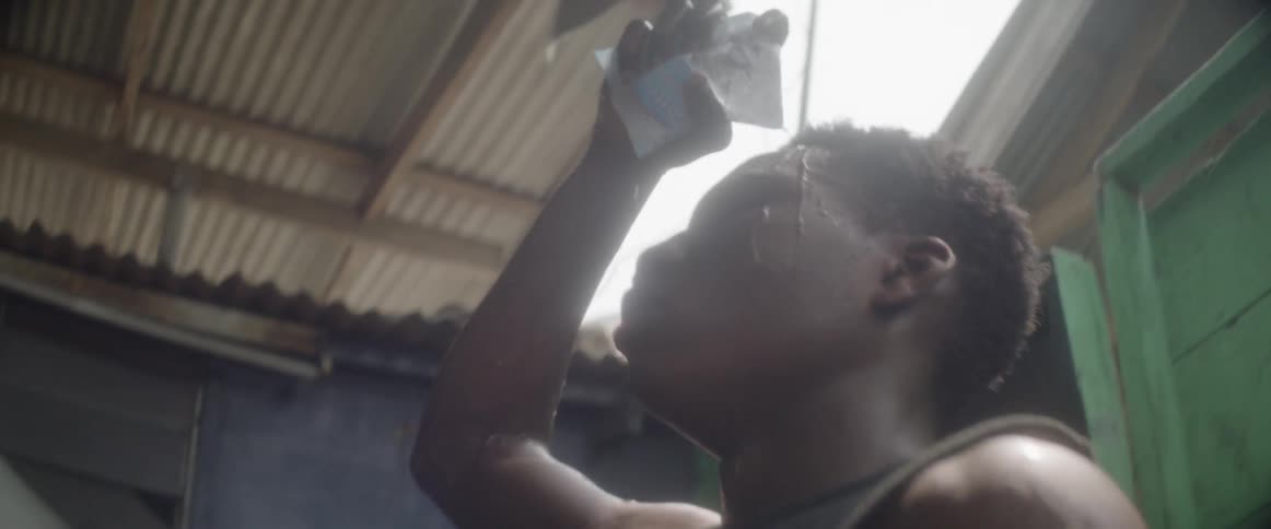 Man rubbing water on his arms and pouring water on his head