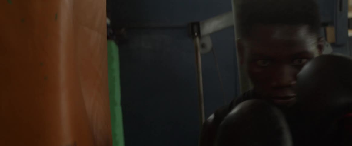 A man punches a heavy bag