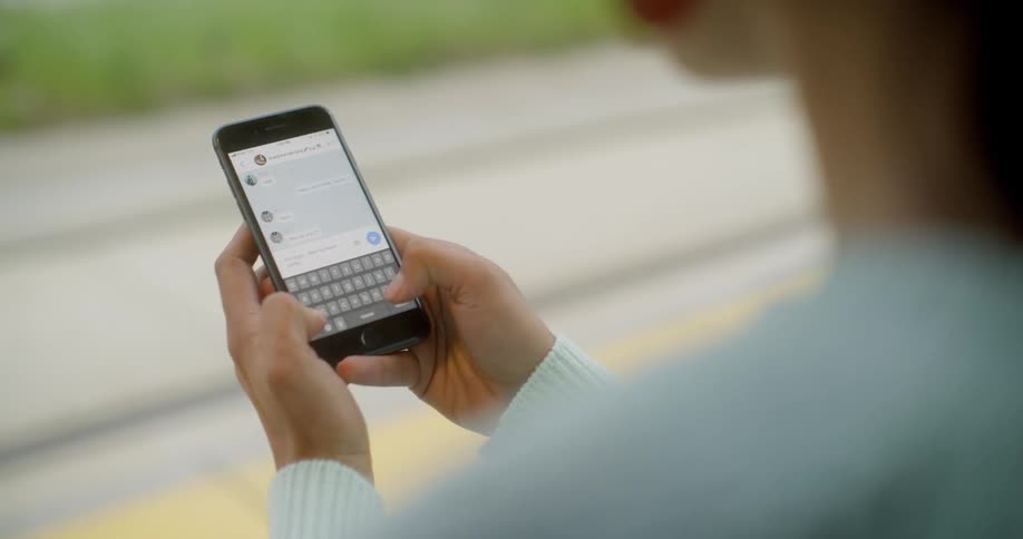Woman texting someone on her mobile phone