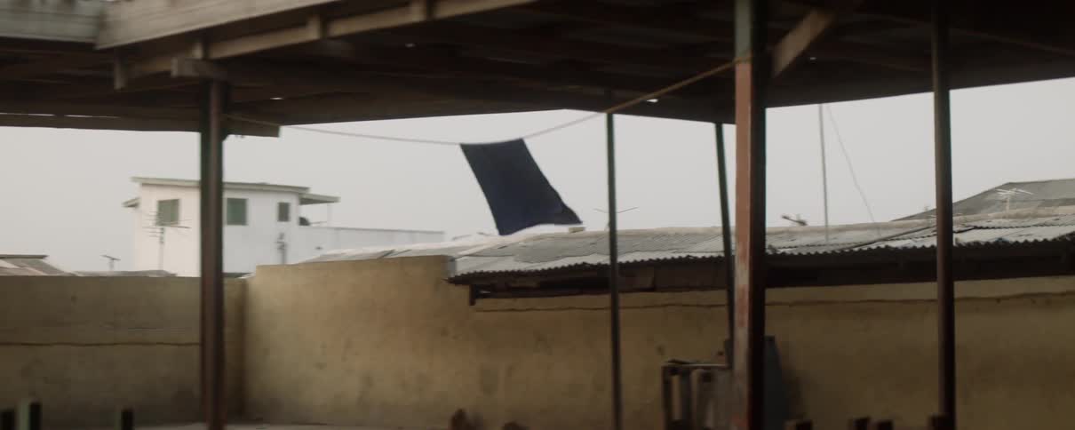 A towel hangs on a clothesline and waves in the wind