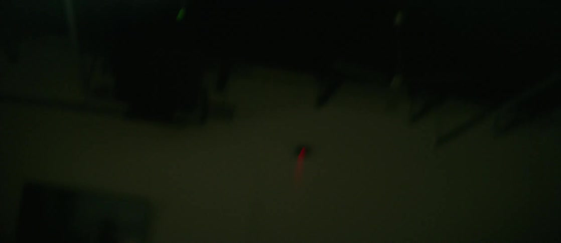 A woman in a white shirt twirls as she dances