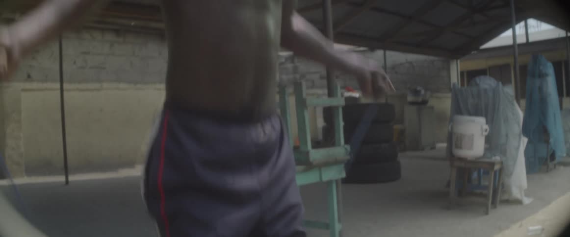 A man jumping rope on the street
