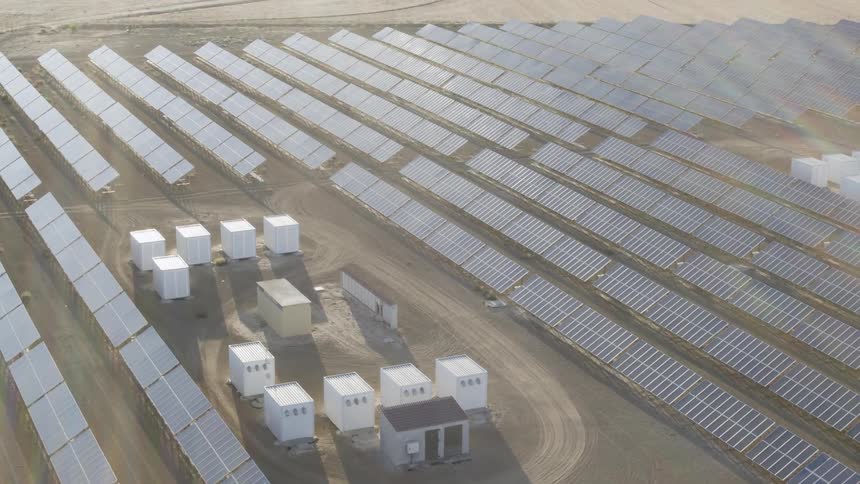 The sun shines on rows of solar panels