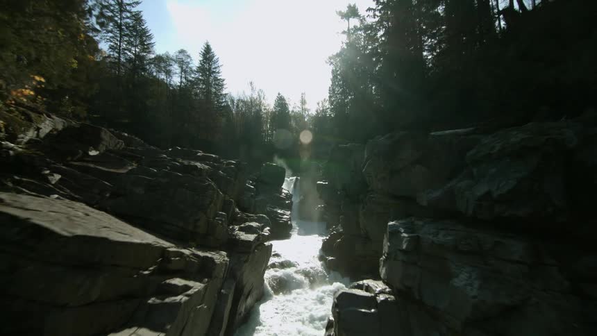 A waterfall cascades over a mountain