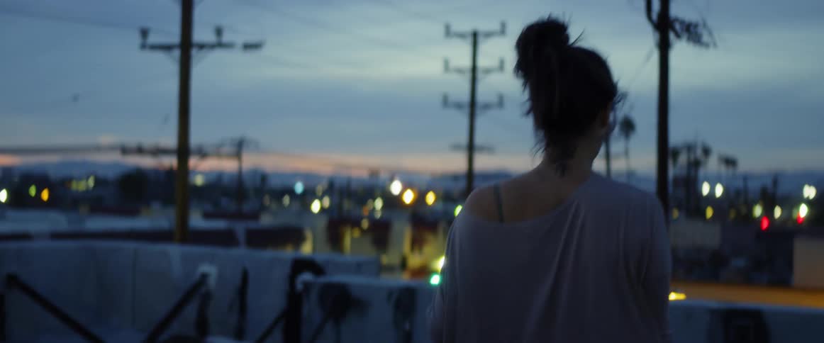 Dancers On Rooftop Overlooking City