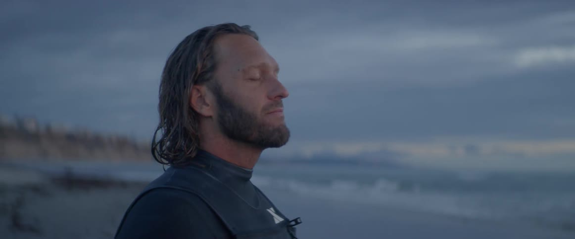 A man is outside at the beach