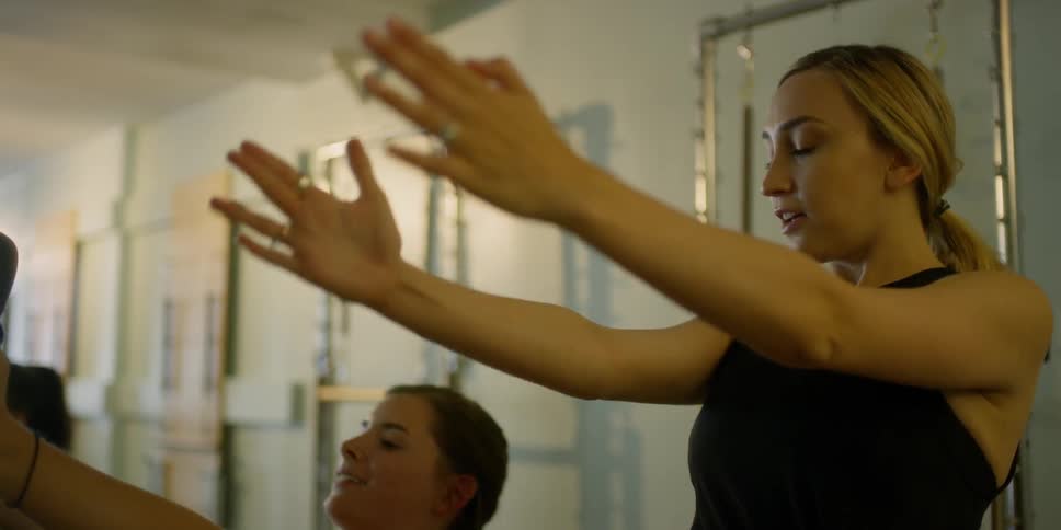 A group of women exercise together