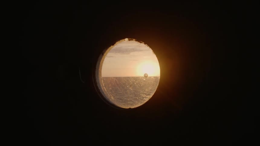 The sun slowly sets on the horizon