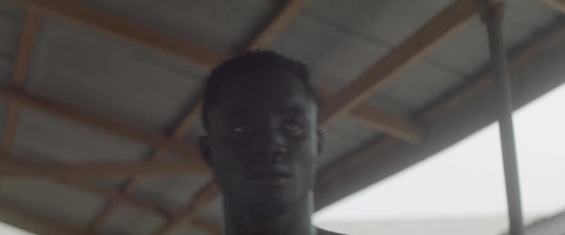 Sweaty man standing in concentration