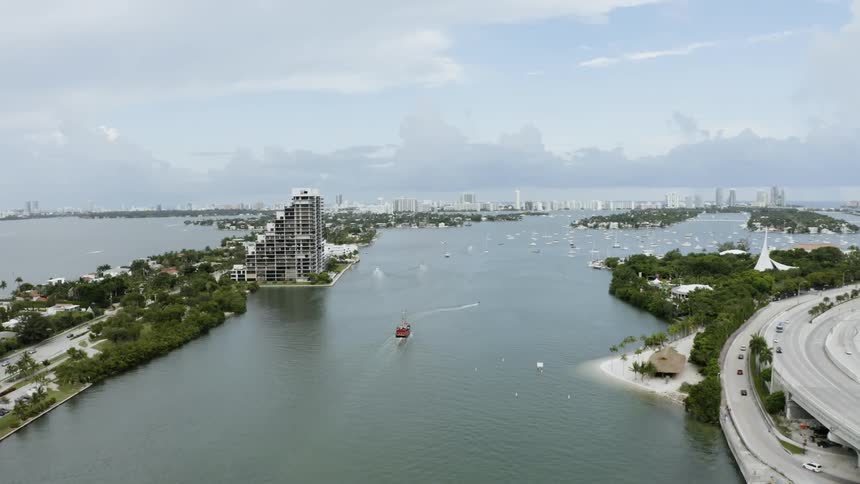 A boat is moving along the water