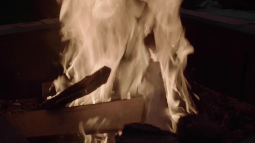 Kindling blazes brightly at night