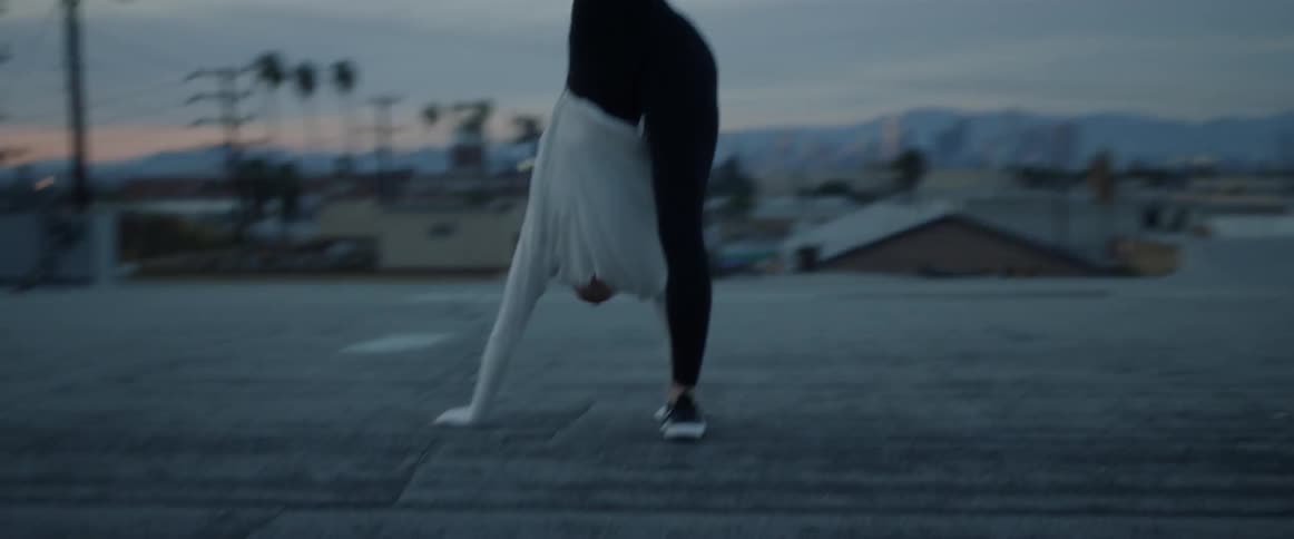 A woman freely dancing in the street