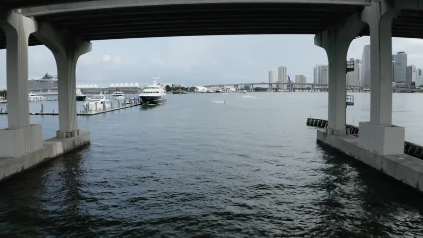 Vehicles moving along a bridge over water