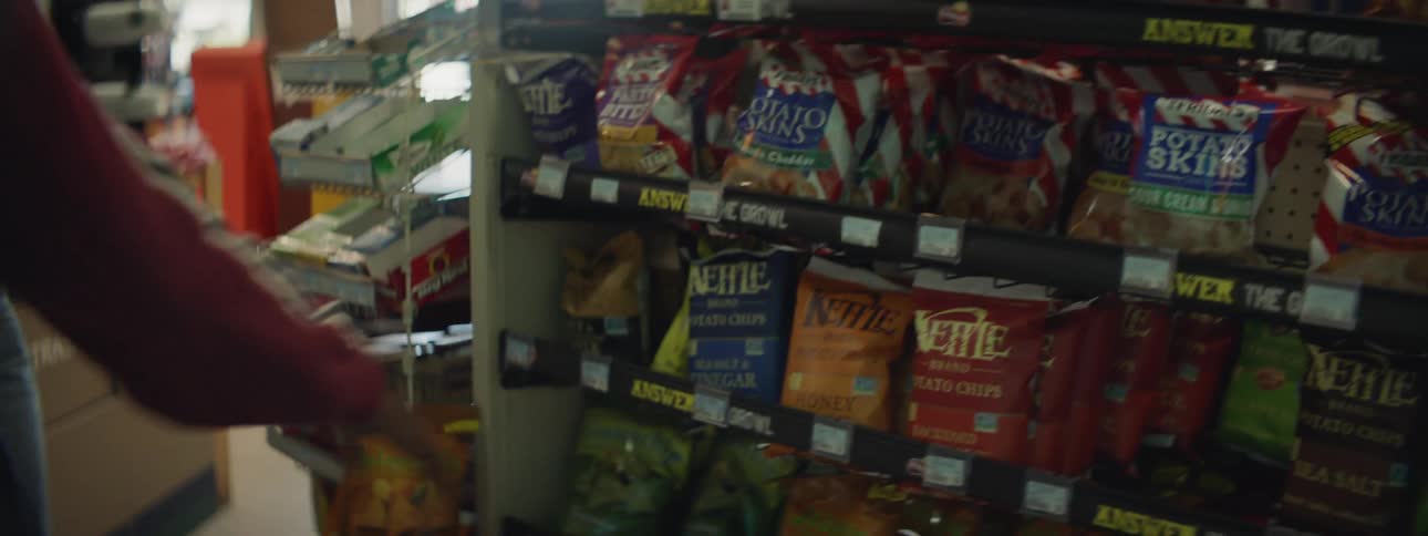 Two women shop at a convenience store