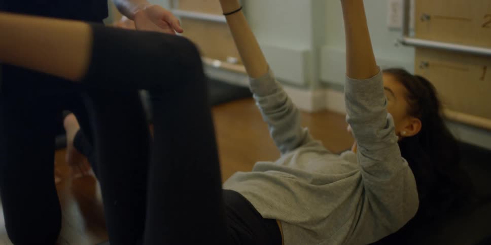 Woman is training another woman during an exercise class
