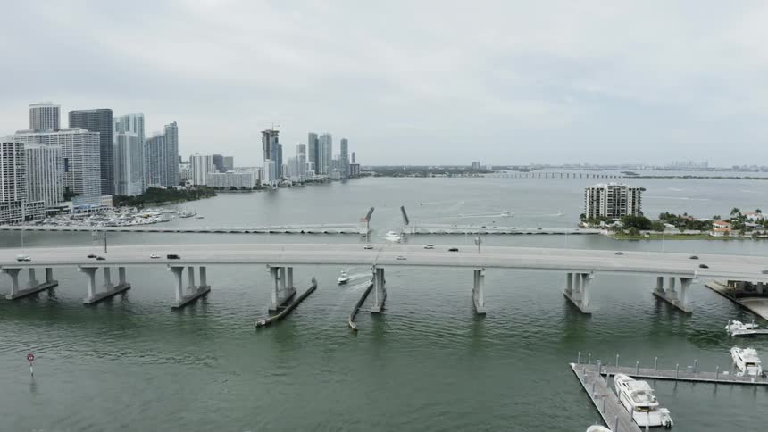 Vehicles travel over the city bridge