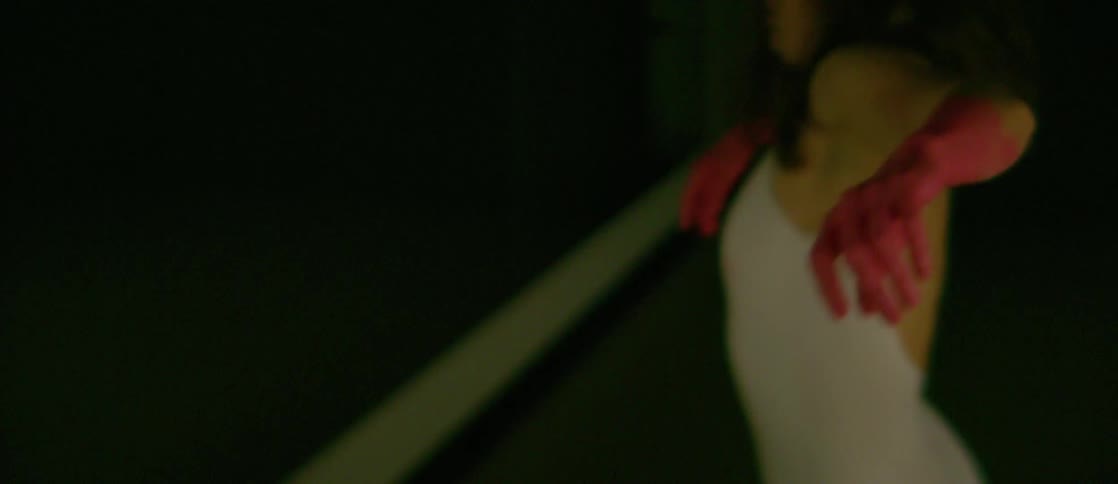 Women dance in a room with strobing lights