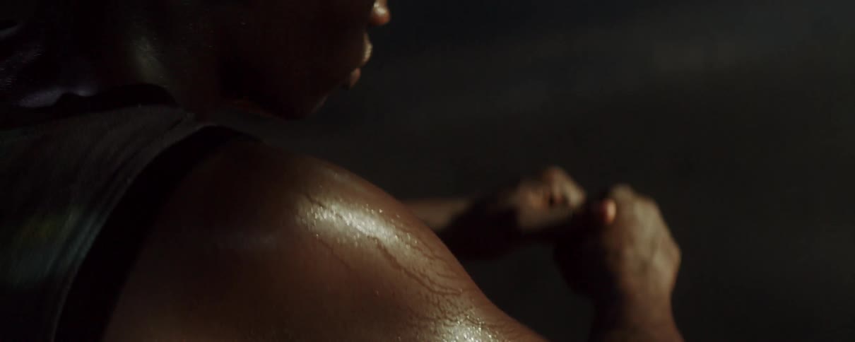 Sweat covered person clenching something between their hands