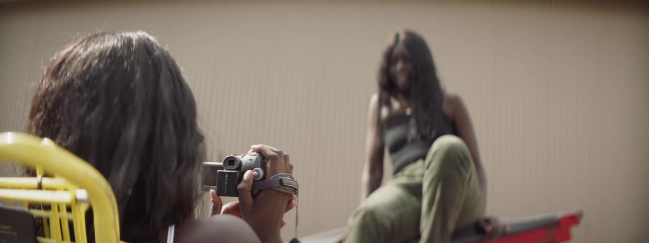 Sisters Filming Each Other With Camcorder