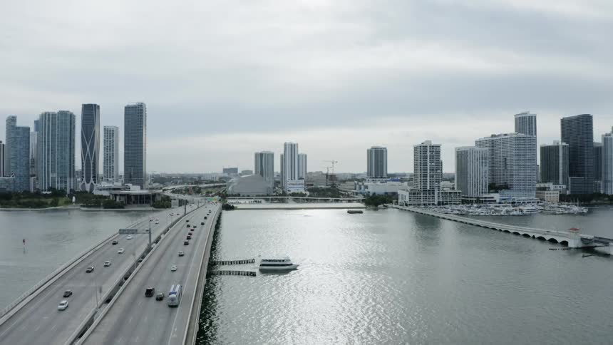 A city line view of a highway and river