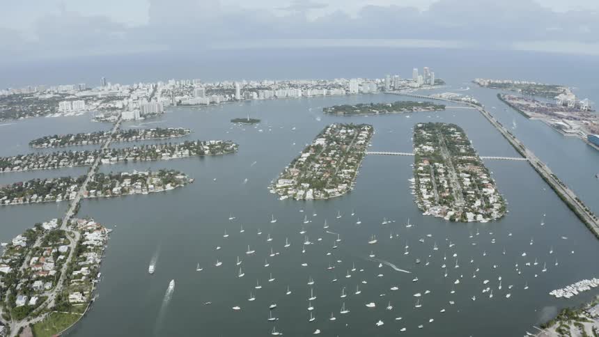 Many boats in the bay on a cloudy day
