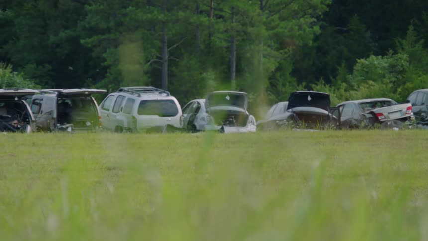 Many cars are parked outside during the daytime
