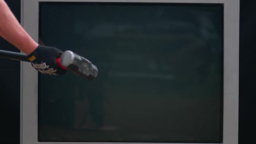 Person holding a mallet draws it back