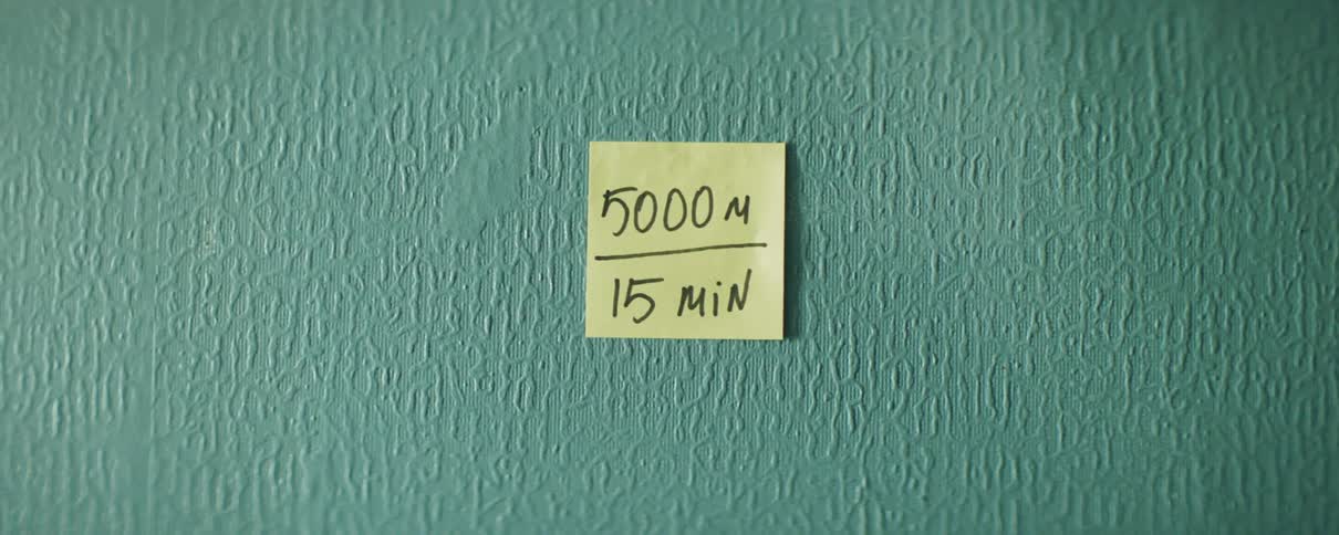 A written message on a sticky note placed on a wall