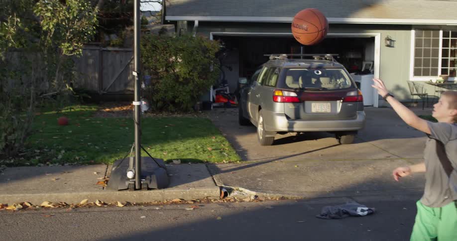 A child is playing basketball