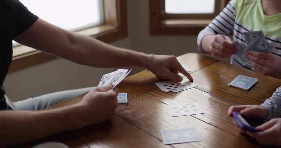People are playing cards