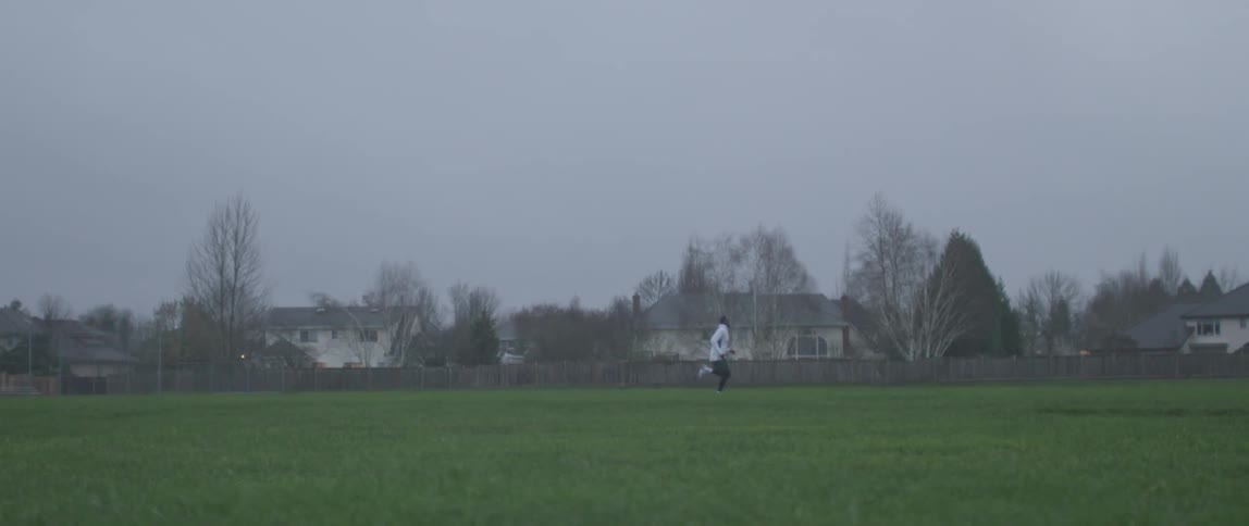 A man runs across the field