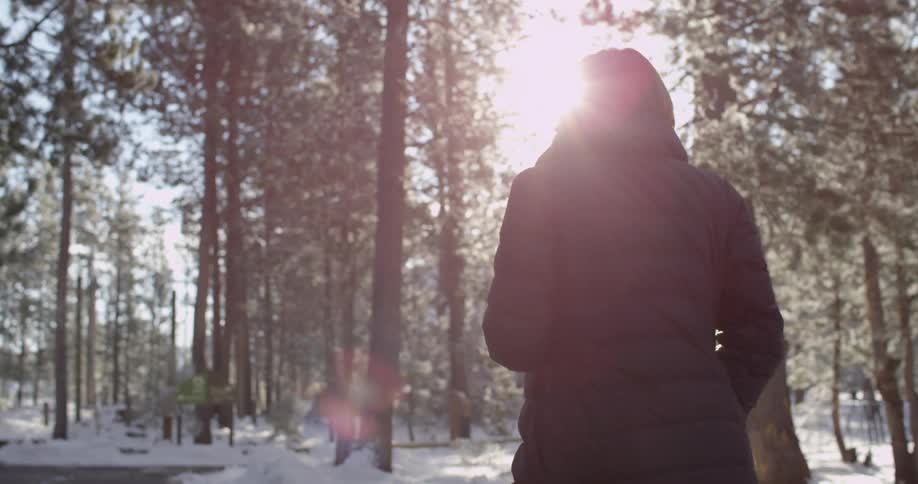A woman walking in the woods