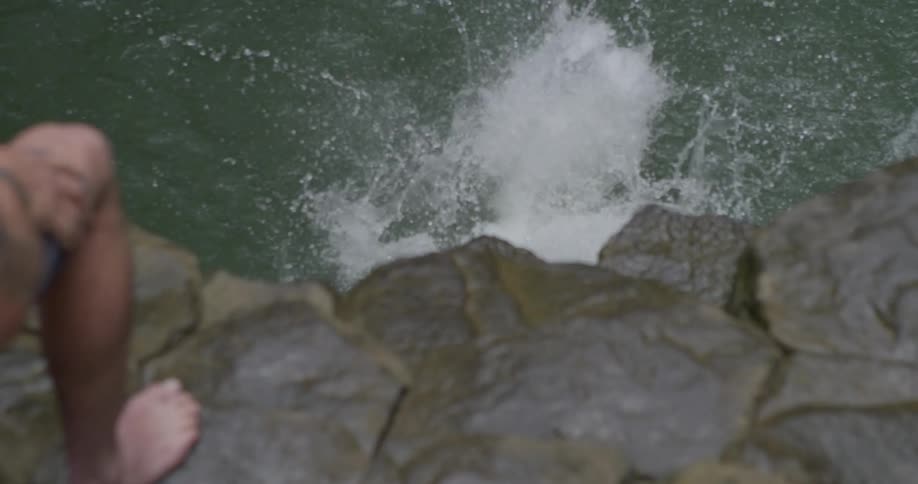 A person jumping off of a cliff