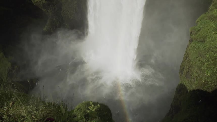 A waterfall rolling down a cliff side
