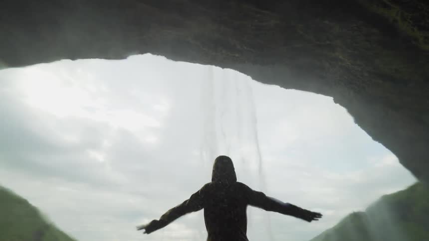 Water is falling on a man