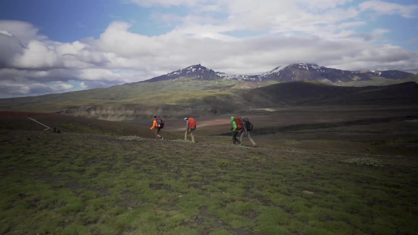A group of people are hiking through the wilderness