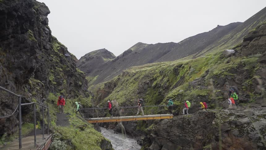 People walking over a bridge