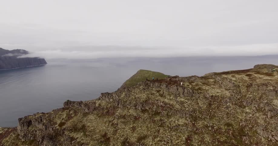 Hikers standing on top of a mountain