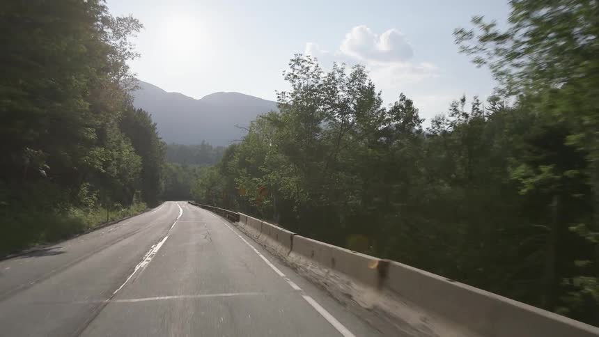 A person drives down the road
