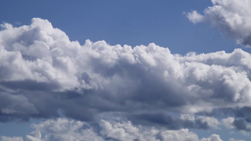 White fluffy clouds in a bright blue sky