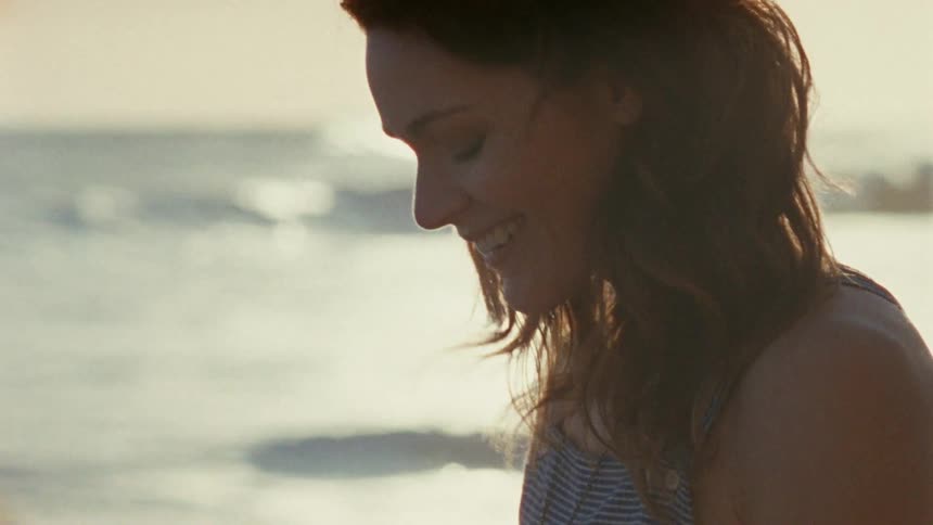 A man proposing to a woman on a beach