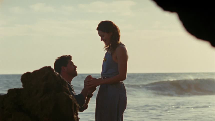 Woman gets proposed to on the beach