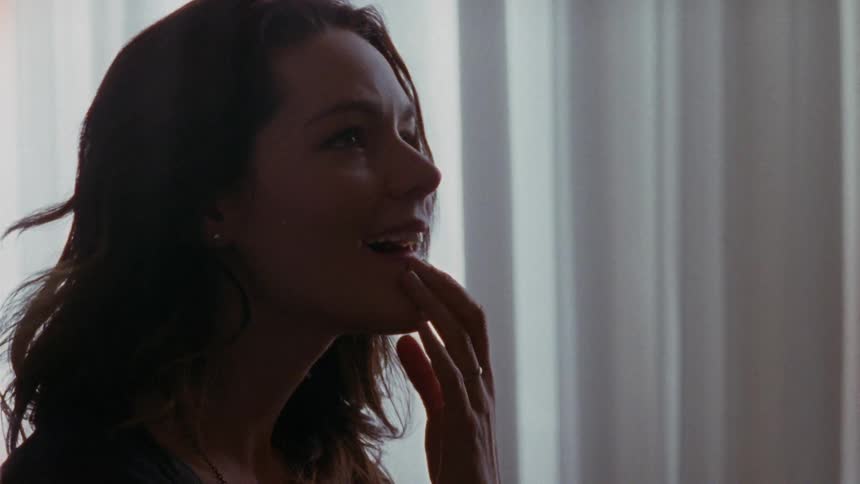 A woman is smiling