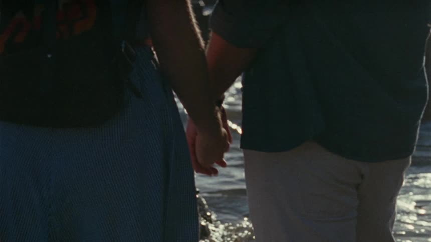 Couple holding hands