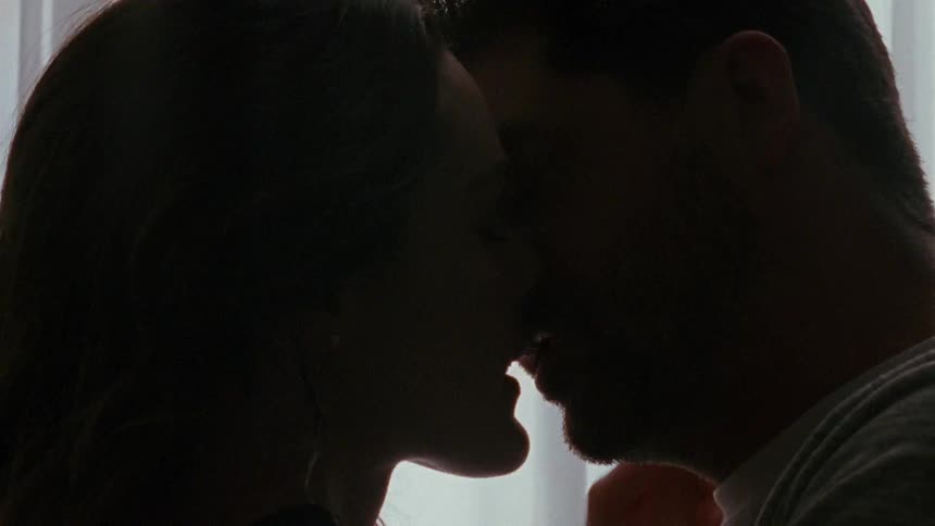 A man and woman kissing each other