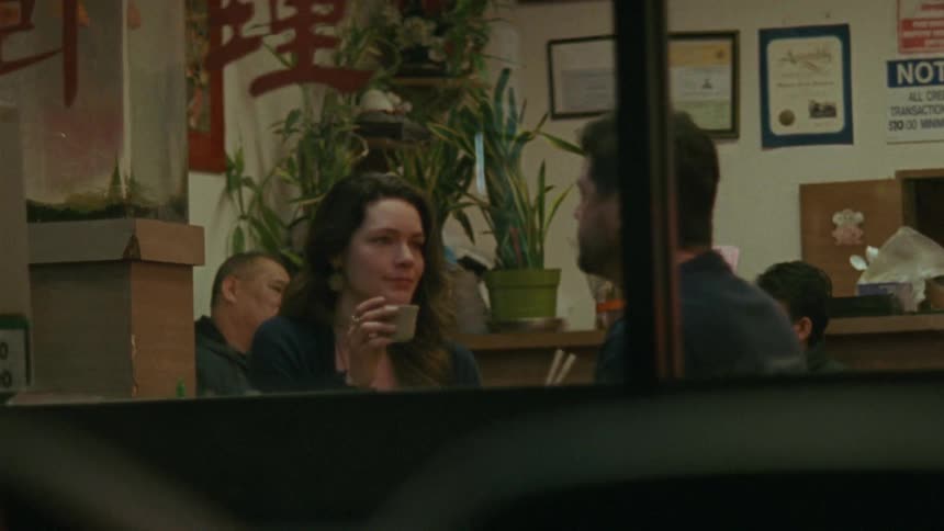 A woman is talking at dinner