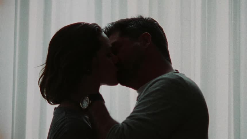 A couple kissing each other