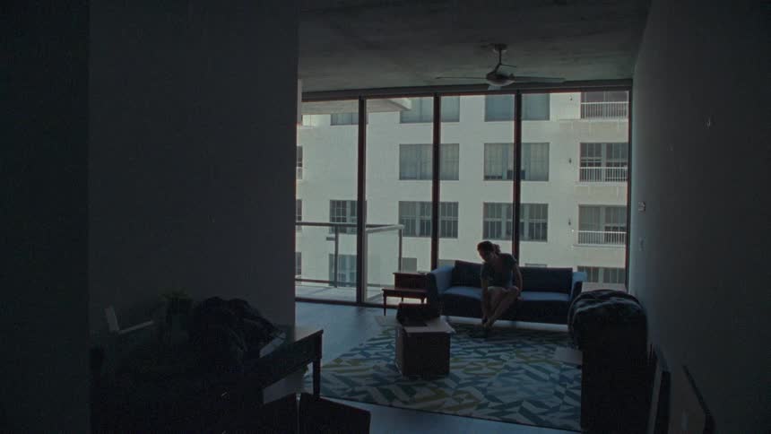 Woman is walking around the living room