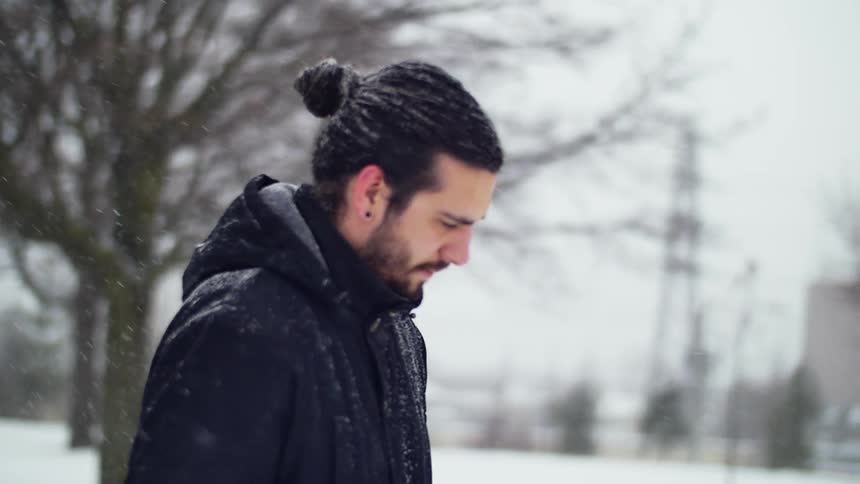 A man walks in a snowstorm